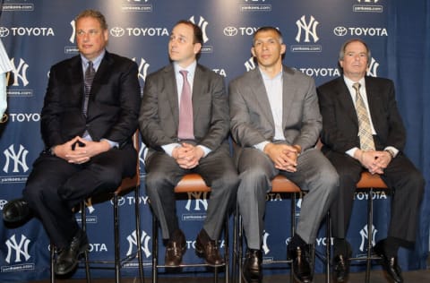 NEW YORK, NY - JANUARY 19: (L-R) President Randy Levine, general manager Brian Cashman, manager Joe Girardi and COO Lonn Trost of the New York Yankees listen as Rafael Soriano , speaks during his introduction press conference on January 19, 2011 at Yankee Stadium in the Bronx borough of New York City. The Yankees signed Soriano to a three-year contract. (Photo by Jim McIsaac/Getty Images)