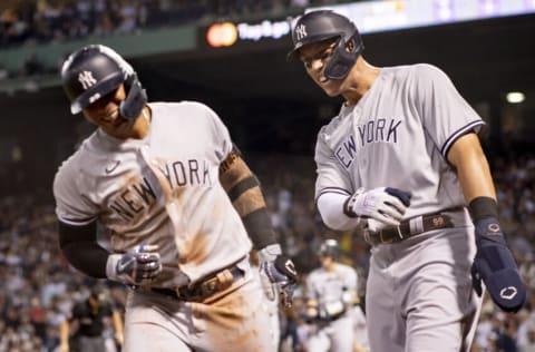 BOSTON, MA - SEPTEMBER 14: Aaron Judge #99 of the New York Yankees reacts with Gleyber Torres #25 of the New York Yankees after scoring during the fifth inning of a game against the Boston Red Sox on September 14, 2022 at Fenway Park in Boston, Massachusetts. (Photo by Maddie Malhotra/Boston Red Sox/Getty Images)