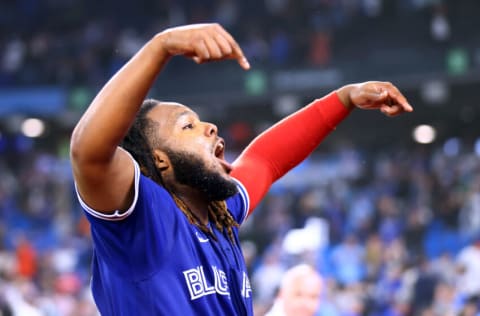 TORONTO, ON - SEPTEMBER 26: Vladimir Guerrero Jr. #27 of the Toronto Blue Jays celebrates his walk-off single in the 10th inning for a 3-2 win against the New York Yankees at Rogers Centre on September 26, 2022 in Toronto, Ontario, Canada. (Photo by Vaughn Ridley/Getty Images)