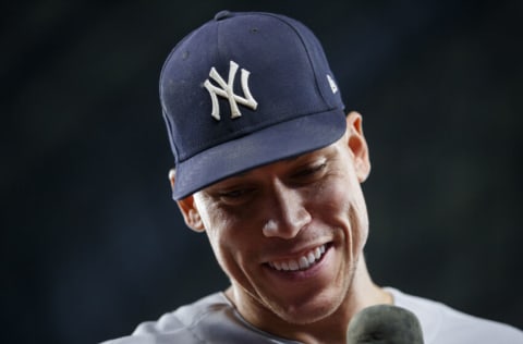 TORONTO, ON - SEPTEMBER 28: Aaron Judge #99 of the New York Yankees smiles during a post-game interview after hitting his 61st home run of the season in the seventh inning against the Toronto Blue Jays at Rogers Centre on September 28, 2022 in Toronto, Ontario, Canada. Judge has now tied Roger Maris for the American League record. (Photo by Cole Burston/Getty Images)