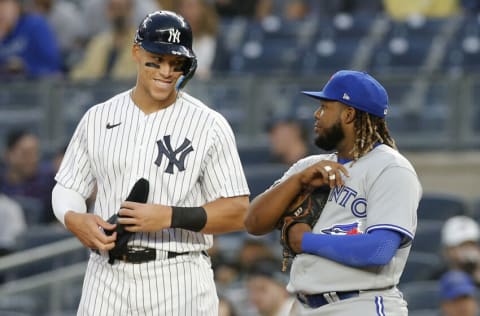 NEW YORK, NEW YORK - APRIL 13: Aaron Judge #99 of the New York Yankees in action against Vladimir Guerrero Jr. #27 of the Toronto Blue Jays at Yankee Stadium on April 13, 2022 in New York City. The Blue Jays defeated the Yankees 6-4. (Photo by Jim McIsaac/Getty Images)