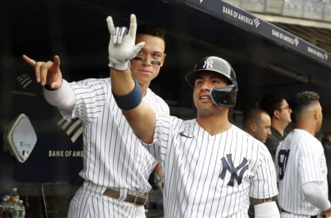 NEW YORK, NEW YORK - SEPTEMBER 07: Gleyber Torres #25 of the New York Yankees celebrates his sixth inning two run home run during game one of a doubleheader against the Minnesota Twins in the dugout with teammate Aaron Judge #99 at Yankee Stadium on September 07, 2022 in the Bronx borough of New York City. (Photo by Jim McIsaac/Getty Images)