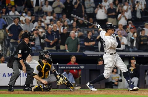 NEW YORK, NEW YORK - SEPTEMBER 20: Aaron Judge #99 of the New York Yankees hits his 60th home run of the season during the 9th inning of the game against the Pittsburgh Pirates at Yankee Stadium on September 20, 2022 in the Bronx borough of New York City. (Photo by Jamie Squire/Getty Images)