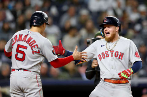 NEW YORK, NEW YORK - SEPTEMBER 23: Enrique Hernandez #5 and Alex Verdugo #99 of the Boston Red Sox celebrate after Verdugo hit a three run home run in the sixth inning against the New York Yankees at Yankee Stadium on September 23, 2022 in the Bronx borough of New York City. (Photo by Elsa/Getty Images)