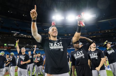 TORONTO, ON - SEPTEMBER 27: Aaron Judge #99 of the New York Yankees celebrates on field after their team defeated the Toronto Blue Jays to clinch first place in the AL East following their MLB game at the Rogers Centre on September 27, 2022 in Toronto, Ontario, Canada. (Photo by Mark Blinch/Getty Images)