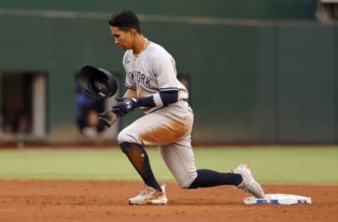 ARLINGTON, TX - OCTOBER 5: Oswaldo Cabrera #95 of the New York Yankees flips his helmet after being forced out at second base against the Texas Rangers during the sixth inning of the game at Globe Life Field on October 5, 2022 in Arlington, Texas. (Photo by Ron Jenkins/Getty Images)