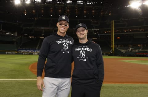 ARLINGTON, TX - OCTOBER 04: Aaron Judge #99 of the New York Yankees poses for a photo with Gerrit Cole #45 following the second game of a doubleheader at Globe Life Field on Tuesday, October 4, 2022 in Arlington, Texas. Judge hit his 62nd home run of the season to break Roger Maris' single-season American League home run record, while Cole surpassed Ron Guidry's single-season record for strikeouts by a Yankees pitcher. (Photo by New York Yankees/Getty Images)