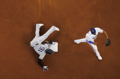 ARLINGTON, TX - OCTOBER 04: Oswald Peraza #91 of the New York Yankees steals second base during a game against the Texas Rangers at Globe Life Field on October 4, 2022 in Arlington, Texas. (Photo by Ben Ludeman/Texas Rangers/Getty Images)