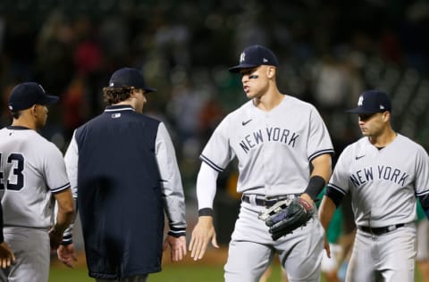 OAKLAND, CALIFORNIA - AUGUST 26: Aaron Judge #99 of the New York Yankees celebrates with teammates after a win against the Oakland Athletics at RingCentral Coliseum on August 26, 2022 in Oakland, California. (Photo by Lachlan Cunningham/Getty Images)