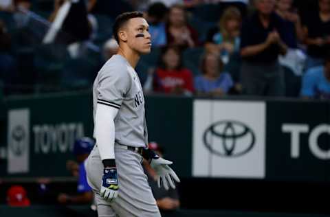 ARLINGTON, TX - OCTOBER 3: Aaron Judge #99 of the New York Yankees reacts after hitting into a double play against the Texas Rangers during the third inning at Globe Life Field on October 3, 2022 in Arlington, Texas. (Photo by Ron Jenkins/Getty Images)