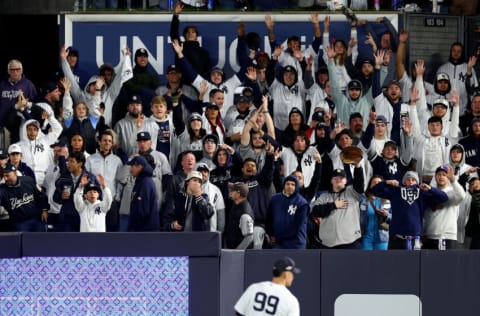 NEW YORK, NEW YORK - OCTOBER 18: New York Yankees fans cheer during the eighth inning against the Cleveland Guardians in game five of the American League Division Series at Yankee Stadium on October 18, 2022 in New York, New York. (Photo by Elsa/Getty Images)