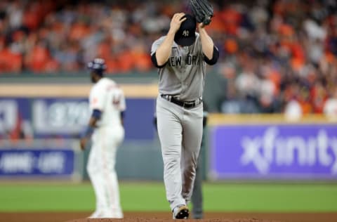 HOUSTON, TEXAS - OCTOBER 19: Clarke Schmidt #86 of the New York Yankees takes a mound during the fifth inning against the Houston Astros in game one of the American League Championship Series at Minute Maid Park on October 19, 2022 in Houston, Texas. (Photo by Carmen Mandato/Getty Images)