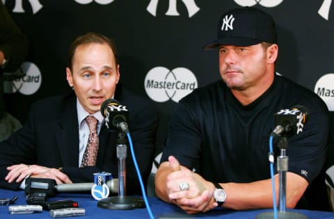 NEW YORK - MAY 06: General Manager Brian Cashman of the New York Yankees (L) speaks to the media as the team announced the signing of Roger Clemens after the Yankees defeated the Seattle Mariners at Yankee Stadium on May 6, 2007 in the Bronx borough of New York City. (Photo by Jim McIsaac/Getty Images)