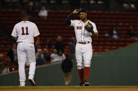 BOSTON, MA - SEPTEMBER 27: Xander Bogaerts #2 of the Boston Red Sox talks with Rafael Devers #11 during the seventh inning against the Baltimore Orioles at Fenway Park on September 27, 2022 in Boston, Massachusetts. (Photo By Winslow Townson/Getty Images)