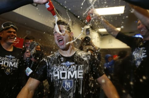 MINNEAPOLIS, MINNESOTA - OCTOBER 07: Tommy Kahnle #48 of the New York Yankees celebrates with teammates in the locker room after sweeping the Minnesota Twins 3-0 in the American League Division Series to advance to the American League Championship Series at Target Field on October 07, 2019 in Minneapolis, Minnesota. (Photo by Elsa/Getty Images)