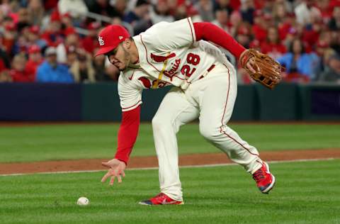 ST LOUIS, MISSOURI - OCTOBER 08: Nolan Arenado #28 of the St. Louis Cardinals fields a ground ball against the Philadelphia Phillies during the seventh inning in game two of the National League Wild Card Series at Busch Stadium on October 08, 2022 in St Louis, Missouri. (Photo by Stacy Revere/Getty Images)