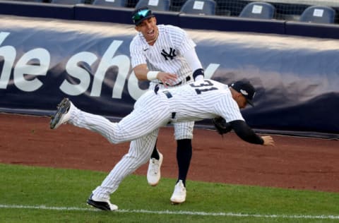 NEW YORK, NEW YORK - OCTOBER 18: Aaron Hicks #31 of the New York Yankees is injured after colliding with Oswaldo Cabrera during the third inning against the Cleveland Guardians in game five of the American League Division Series at Yankee Stadium on October 18, 2022 in New York, New York. (Photo by Al Bello/Getty Images)