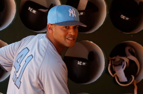 OAKLAND, CA - JUNE 17: Mason Williams #41 of the New York Yankees stands in the dugout before the game against the Oakland Athletics at the Oakland Coliseum on June 17, 2017 in Oakland, California. The Oakland Athletics defeated the New York Yankees 5-2. Players and umpires are wearing blue to celebrate Father's Day weekend and support prostrate cancer awareness. (Photo by Jason O. Watson/Getty Images)