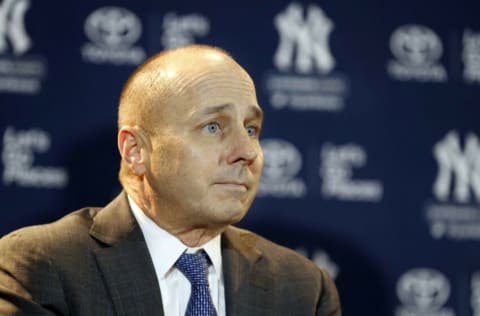 Dec 11, 2017; Orlando, FL, USA; New York Yankees general manager Brian Cashman reacts as outfielder Giancarlo Stanton (not pictured) is introduced at a press conference at Walt Disney World Swan and Dolphin Resort. Mandatory Credit: Kim Klement-USA TODAY Sports