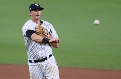 Oct 8, 2020; San Diego, California, USA; New York Yankees second baseman DJ LeMahieu (26) throws to first base to retire Tampa Bay Rays shortstop Willy Adames (not pictured) during the seventh inning of game four of the 2020 ALDS at Petco Park. Mandatory Credit: Orlando Ramirez-USA TODAY Sports