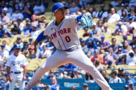 Aug 22, 2021; Los Angeles, California, USA; New York Mets starting pitcher Marcus Stroman (0) throws a pitch in the first inning against the Los Angeles Dodgers at Dodger Stadium. Mandatory Credit: Robert Hanashiro-USA TODAY Sports