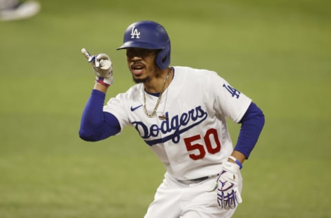 Oct 18, 2020; Arlington, Texas, USA; Los Angeles Dodgers right fielder Mookie Betts (50) reacts after hitting a single in the first inning against the Atlanta Braves during game seven of the 2020 NLCS at Globe Life Field. Mandatory Credit: Tim Heitman-USA TODAY Sports