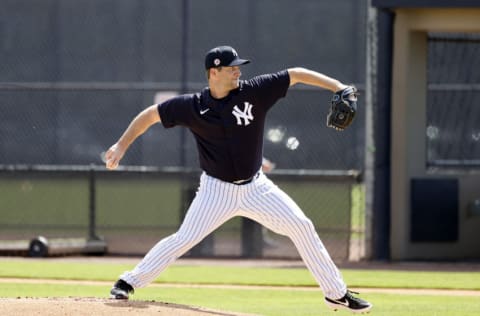 Feb 21, 2021; Tampa, Florida, USA; New York Yankees pitcher Adam Warren (48) throws a pitch during live batting practice at Yankees player development complex. Mandatory Credit: Kim Klement-USA TODAY Sports