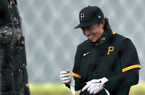 Feb 24, 2021; Bradenton, Florida, USA; Pittsburgh Pirates catcher Tony Wolters (93) has some fun while taking batting practice during spring training at Pirate City. Mandatory Credit: Jonathan Dyer-USA TODAY Sports