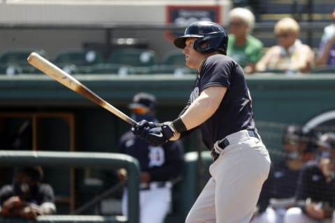 Mar 16, 2021; Lakeland, Florida, USA; New York Yankees left fielder Clint Frazier (77) hits a RBI single during the first inning against the Detroit Tigers at Publix Field at Joker Marchant Stadium. Mandatory Credit: Kim Klement-USA TODAY Sports