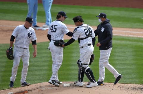 Apr 1, 2021; Bronx, New York, USA; New York Yankees manager Aaron Boone takes starting pitcher Gerrit Cole (45) out of the game during the sixth inning of an opening day game against the Toronto Blue Jays at Yankee Stadium. Mandatory Credit: Brad Penner-USA TODAY Sports