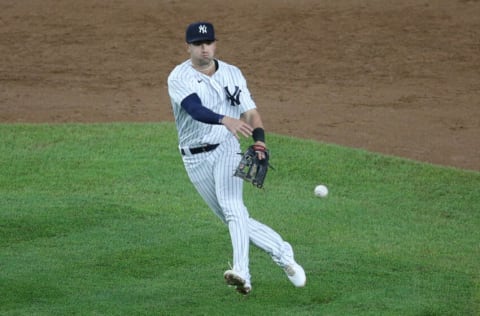 May 5, 2021; Bronx, New York, USA; New York Yankees second baseman Tyler Wade (14) throws out Houston Astros shortstop Carlos Correa (not pictured) during the ninth inning at Yankee Stadium. Mandatory Credit: Brad Penner-USA TODAY Sports