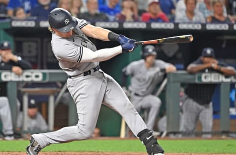 Aug 9, 2021; Kansas City, Missouri, USA; New York Yankees first baseman Luke Voit (59) singles in a run against the Kansas City Royals during the seventh inning at Kauffman Stadium. Mandatory Credit: Peter Aiken-USA TODAY Sports