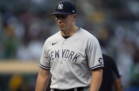 Aug 29, 2021; Oakland, California, USA; New York Yankees pitcher Chad Green (57) walks off the field after giving up a two-run home run to Oakland Athletics left fielder Tony Kemp during the eighth inning at RingCentral Coliseum. Mandatory Credit: D. Ross Cameron-USA TODAY Sports