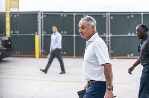 Feb 28, 2022; Jupiter, FL, USA; Major League Baseball Commissioner Rob Manfred, center, walks after negotiations with the players association in an attempt to reach an agreement to salvage March 31 openers and a 162-game season, Monday, Feb. 28, 2022, at Roger Dean Stadium in Jupiter, Fla. Mandatory Credit: Greg Lovett-USA TODAY NETWORK