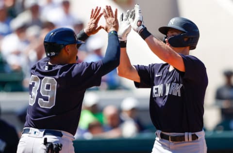 Mar 28, 2022; Lakeland, Florida, USA; New York Yankees second baseman Cooper Bowman (74) is congratulated by infielder Philip Evans (39) after hitting a three run home run in the sixth inning during spring training at Publix Field at Joker Marchant Stadium. Mandatory Credit: Nathan Ray Seebeck-USA TODAY Sports