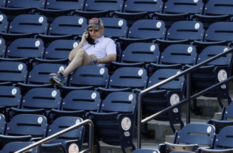 Feb 24, 2021; Tampa, Florida, USA; New York Yankees general manager Brian Cashman looks on during spring training workouts at George M. Steinbrenner Field. Mandatory Credit: Kim Klement-USA TODAY Sports