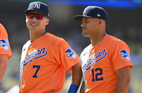 Jul 16, 2022; Los Angeles, CA, USA; American League Futures shortstop Anthony Volpe (7) and American League Futures center fielder Jasson Dominguez (12) are introduced for the All Star-Futures Game at Dodger Stadium. Mandatory Credit: Jayne Kamin-Oncea-USA TODAY Sports