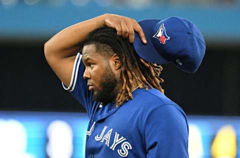 Jul 27, 2022; Toronto, Ontario, CAN; Toronto Blue Jays first baseman Vladimir Guerrero Jr. (27) looks on as the Jays relieve starting pitcher Kevin Gausman (not shown) in the fifth inning against the St. Louis Cardinals at Rogers Centre. Mandatory Credit: Dan Hamilton-USA TODAY Sports