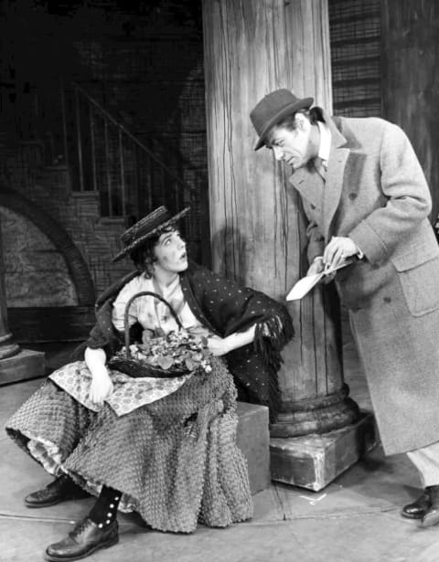 Eliza Doolittle (Julie Andrews) meets Professor Henry Higgins (Rex Harrison) in My Fair Lady.