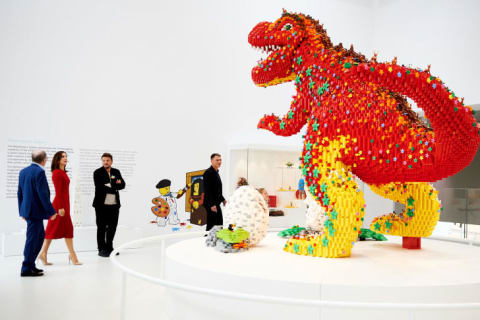 LEGO House visitors browse the Masterpiece Gallery, a display of works by members of the brand's artistic community.