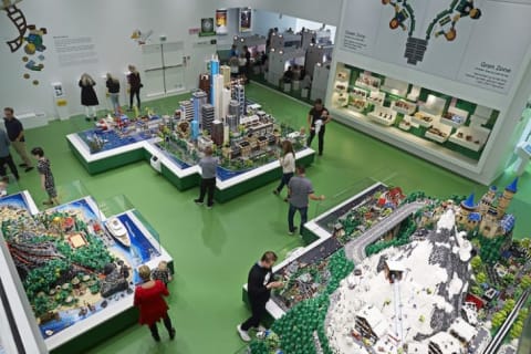 Kids play with LEGOs in the World Explorer section, which has three themed islands filled with LEGO mini-figures. The LEGO Group