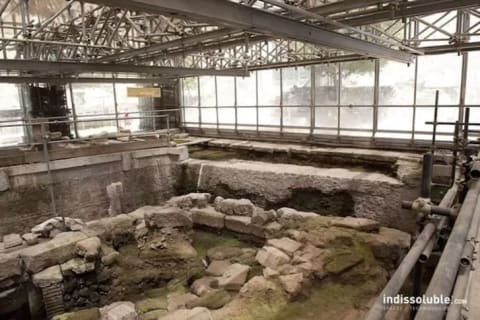 The same site with the roof peeled away, showing the very ancient site under the Augustan pavements.