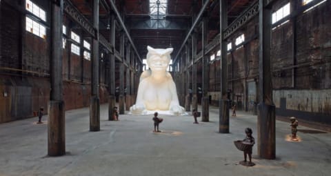 At the behest of Creative Time Kara E. Walker has confected: A Subtlety, or the Marvelous Sugar Baby, an Homage to the unpaid and overworked Artisans who have refined our Sweet tastes from the cane fields to the Kitchens of the New World on the Occasion of the demolition of the Domino Sugar Refining Plant. A project of Creative Time. Domino Sugar Refinery, Brooklyn, NY, May 10 to July 6, 2014.