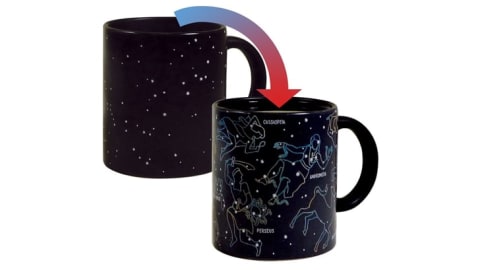 Two mugs showing the before and after look of the heat-changing mug with constellations on it