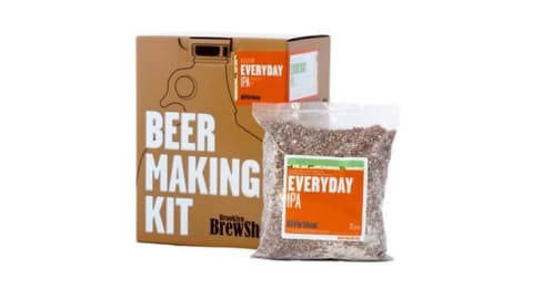 A beer making kit in a box next to a grain mixture that says 'Everyday IPA'